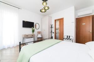 Łóżko lub łóżka w pokoju w obiekcie B&B Palazzo Pinto 2