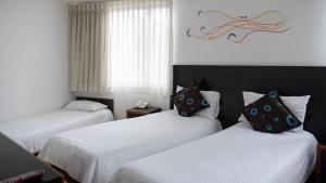 Postel nebo postele na pokoji v ubytování Benidorm Hotel