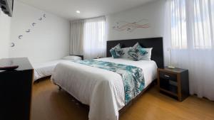 Postel nebo postele na pokoji v ubytování Benidorm Hotel