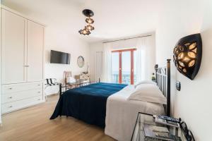 Łóżko lub łóżka w pokoju w obiekcie B&B Palazzo Pinto 2