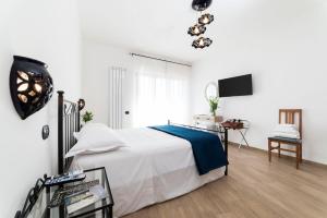 Łóżko lub łóżka w pokoju w obiekcie B&B Palazzo Pinto 2