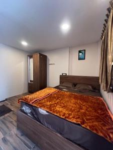 Postel nebo postele na pokoji v ubytování Asoor Guest House