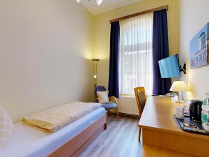 Letto o letti in una camera di Hotel Graf Waldersee