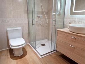 a bathroom with a shower and a toilet and a sink at Villmor - B53 - Coma De Albá, 1º in Benasque +14 photos