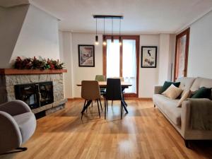 a living room with a couch and a table at Villmor - B53 - Coma De Albá, 1º in Benasque