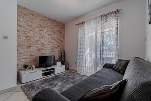 TV a/nebo společenská místnost v ubytování House Ivan