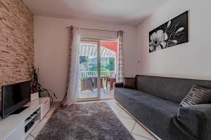 TV a/nebo společenská místnost v ubytování House Ivan