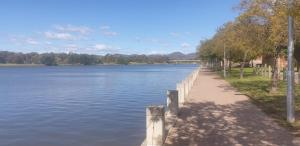 a path next to a large body of water at Anketell Views in Canberra