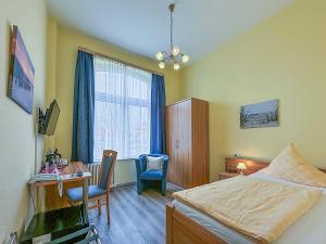 Letto o letti in una camera di Hotel Graf Waldersee