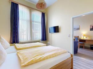 Letto o letti in una camera di Hotel Graf Waldersee