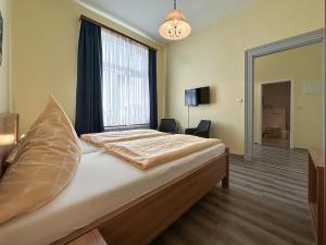 Letto o letti in una camera di Hotel Graf Waldersee
