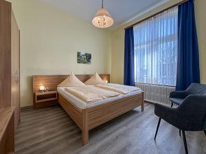 Letto o letti in una camera di Hotel Graf Waldersee