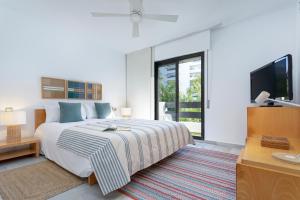 Łóżko lub łóżka w pokoju w obiekcie Genteel Home Guadalvillas