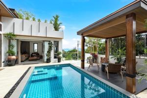 an image of a house with a swimming pool at Villa Lom Talay - Family Retreat in Ban Thong Phlu
