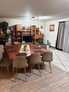 a dining room with a table and chairs at Casa Nicole in Moieciu de Jos