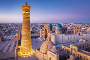 a view of a city with a mosque and a tall tower at Whole Guest House Rental In the Center of Tourism Area in Bukhara