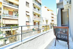 a balcony of a building with a bench on it at Modern Flat in Central Athens - Asphodelus in Athens