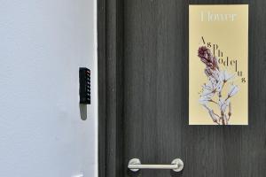 a door with a picture of a flower on it at Modern Flat in Central Athens - Asphodelus in Athens