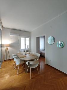 a dining room with a table and chairs at Kolonaki 2 bedroom Flat in Athens