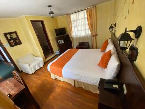Letto o letti in una camera di Kituandes Hotel