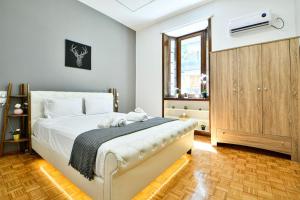 Postel nebo postele na pokoji v ubytování Cozy Flat in Central Athens - Iris