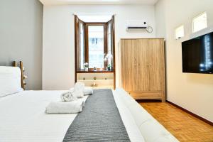 Postel nebo postele na pokoji v ubytování Cozy Flat in Central Athens - Iris