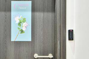 a picture of a flower hanging on a door at City Center Flat with Terrace (Capparis) in Athens