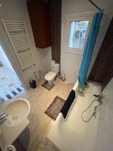 a bathroom with a sink and a toilet at Corniche in Sousse +5 photos