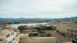 a view of a city with a river and buildings at Panoramic Seaview in Olbia