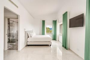 Posteľ alebo postele v izbe v ubytovaní La Maison dell'Oasi