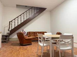 a dining room with a table and chairs and a couch at Apt in the heart of Perugia, near Corso Vannucci in Perugia