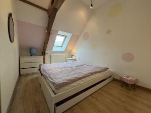 a bedroom with a bed in a room at La Parenthèse Verte - 8pers - Piscine - Rêve au Mans in Roézé-sur-Sarthe