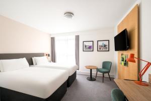 Postel nebo postele na pokoji v ubytování Holiday Inn Birmingham City by IHG + 37 fotografií