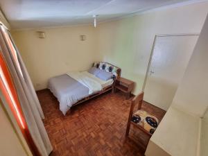 Ένα ή περισσότερα κρεβάτια σε δωμάτιο στο Leafy Expat Houseshare