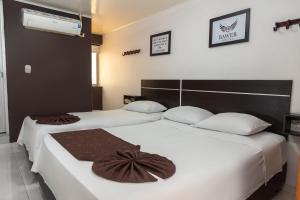 Postel nebo postele na pokoji v ubytování Hotel BAWER