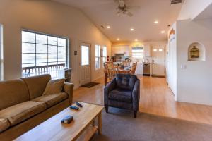 a living room with a couch and a table at Wapato Lake Waterfront Retreat in Manson