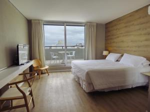 Postel nebo postele na pokoji v ubytování Smart Hotel Montevideo