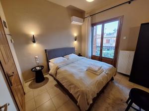 Postel nebo postele na pokoji v ubytování Skourgias Rooms
