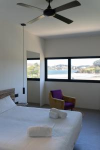 A bed or beds in a room at AFTER Hotel