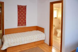 Posteľ alebo postele v izbe v ubytovaní Panoráma Apartmanház