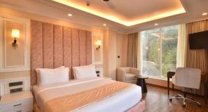 Postel nebo postele na pokoji v ubytování Claret Inn & Suites - Dalhousie