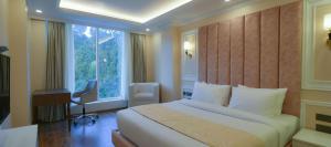 Postel nebo postele na pokoji v ubytování Claret Inn & Suites - Dalhousie