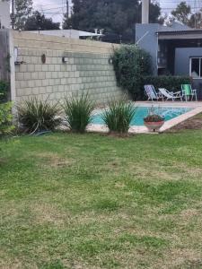 a backyard with a swimming pool and grass at Loft San Francisco, Cordoba in San Francisco +15 photos