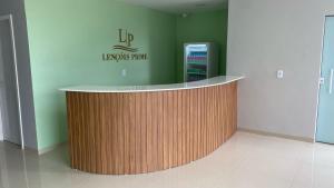 a lobby with a circular counter in a building at Lençóis Prime Hotel in Barreirinhas
