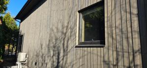 a window on the side of a house at Beautifull house with 7 bedrooms in Sandefjord