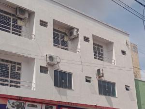 a building with windows and air conditioners on it at Refúgio no Centro in Imperatriz
