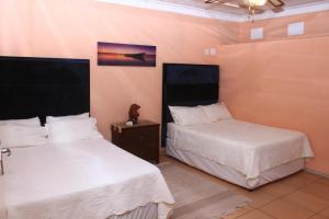 Un ou plusieurs lits dans un hébergement de l'établissement Ankuweni Guest house
