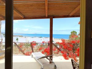 a view of the ocean from the porch of a house at Boadream Ca' Madeira 1 Attico Linea Prestige in Sal Rei