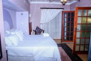 Un ou plusieurs lits dans un hébergement de l'établissement Ankuweni Guest house