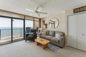 a living room with a couch and a table at Stunning Ocean Views from the 10th Floor condo in Myrtle Beach +30 photos